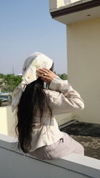 girl styling her scarf on holiday