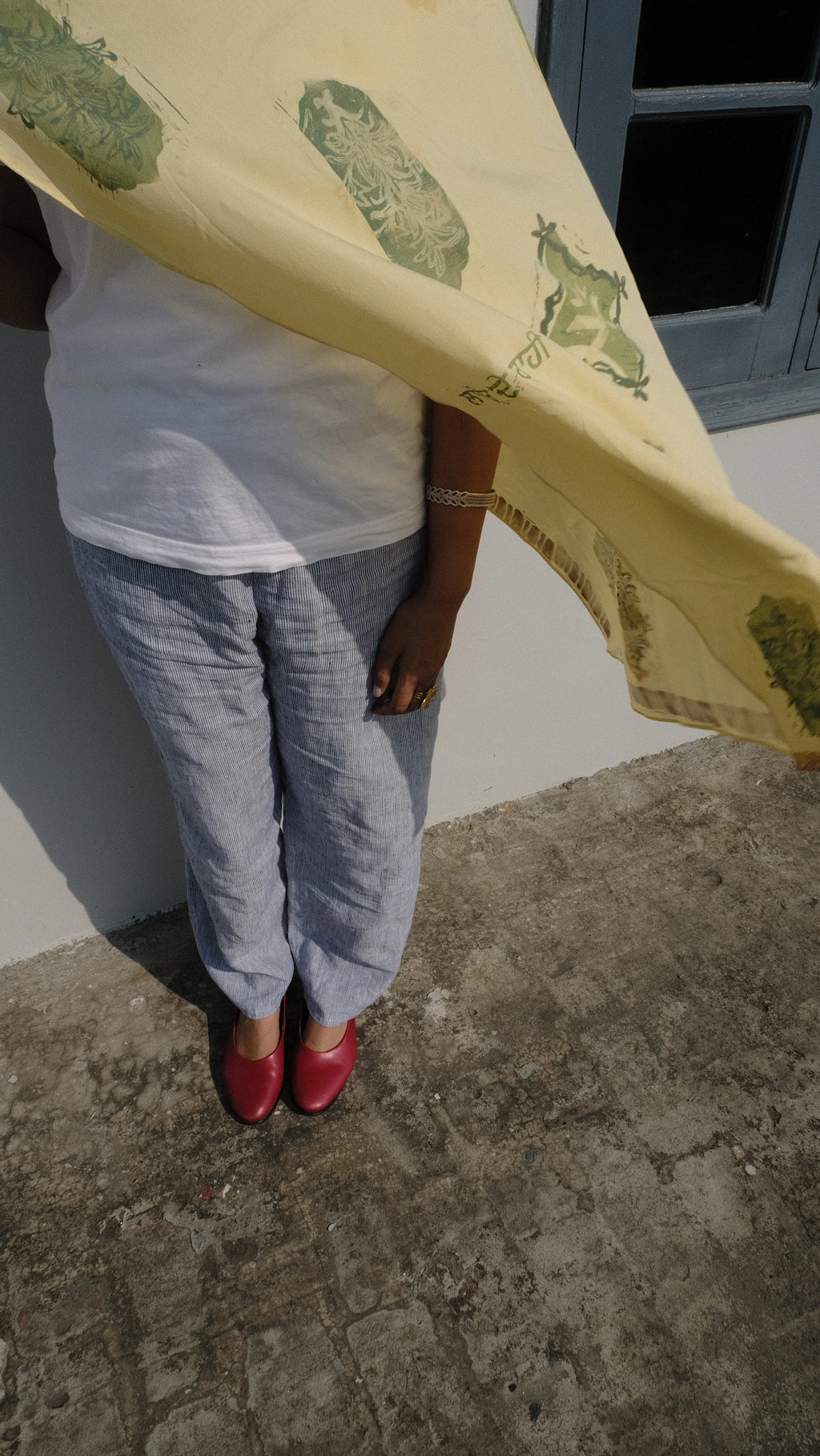 scarf blowing away whilst draped on a girl
