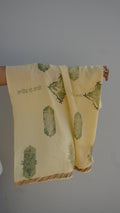 handprinted scarf draped on the arm as a heritage display