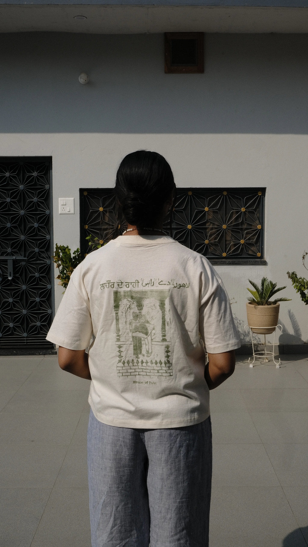 handprinted tshirt girl standing in panjabi courtyard