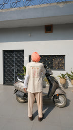bapu standing in front of his scooter wearing a handprinted tshirt