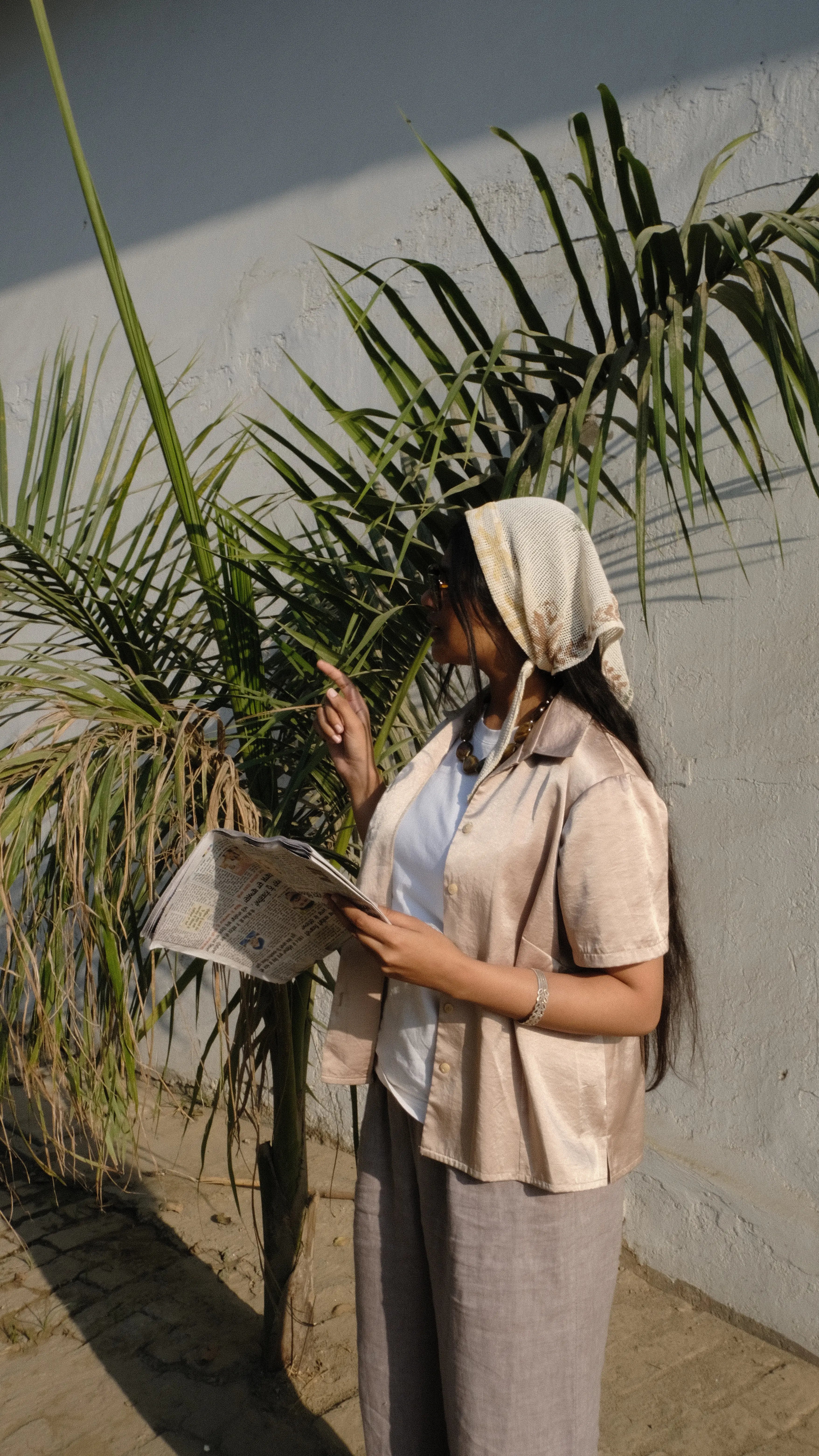 Girl looking at a map whilst exploring the city Lahore